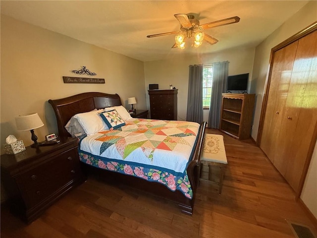 27288 State Highway 16, Ashmore, IL 61912 - bedroom with wood finished floors, a closet, and a ceiling fan
