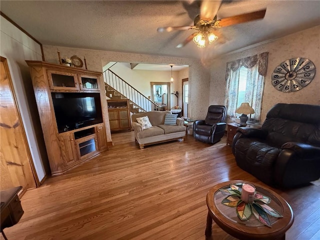 27288 State Highway 16, Ashmore, IL 61912 - living area with light wood-style floors, stairway, ceiling fan, and a textured ceiling