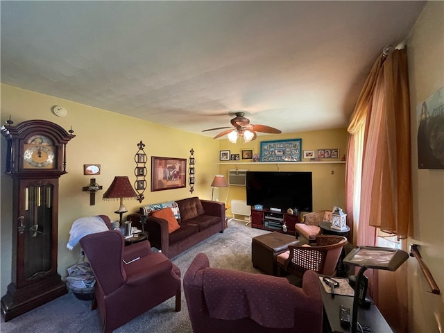 carpeted living room with a wall unit AC and ceiling fan