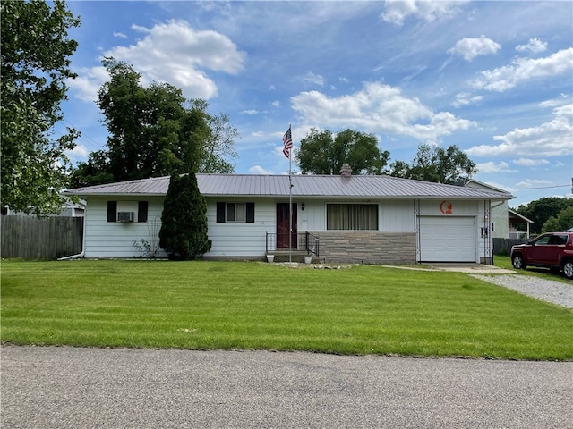 ranch-style home with a front yard and a garage