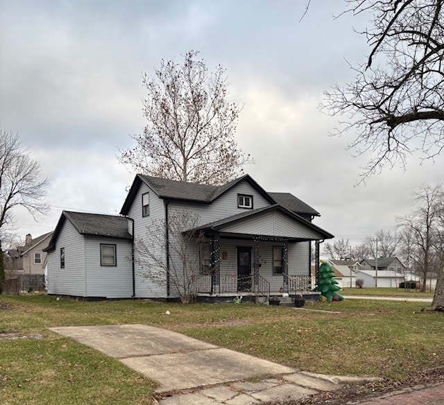 bungalow-style house featuring a porch and a front yard