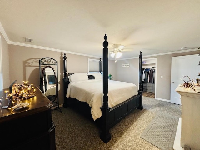 bedroom with visible vents, baseboards, a spacious closet, ornamental molding, and a closet