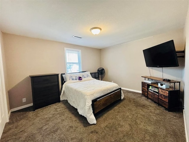 carpeted bedroom with visible vents and baseboards