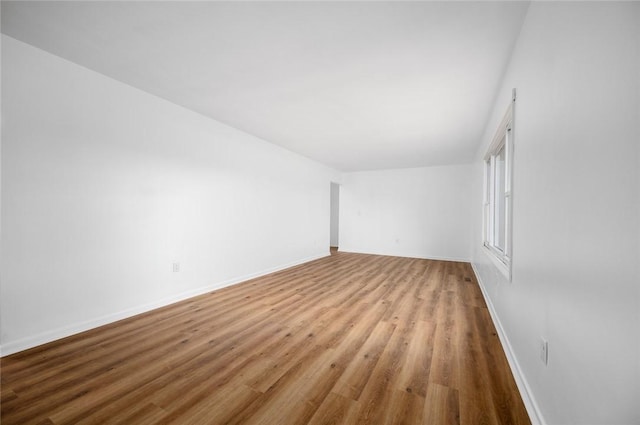 unfurnished room with light wood-type flooring