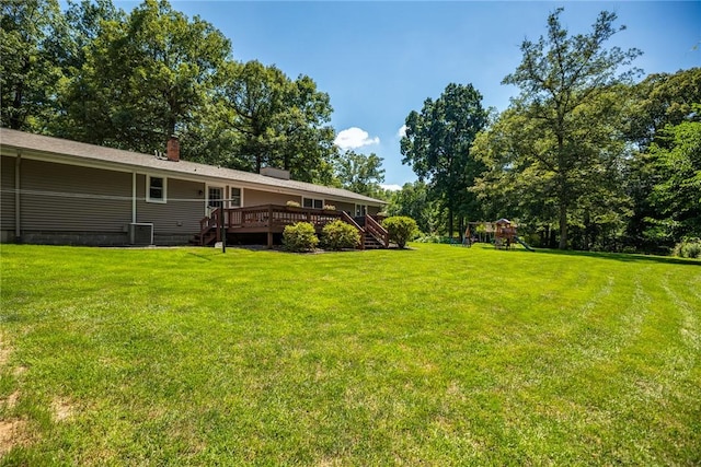 18058 E 1545th Ave, Teutopolis, IL 62467 - view of grassy yard featuring a playground, a deck, and stairway
