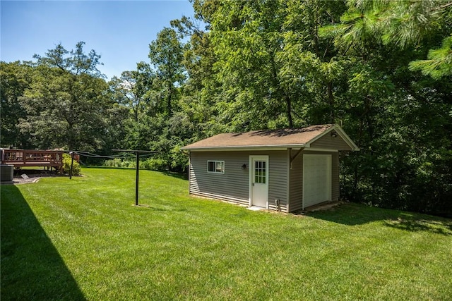 18058 E 1545th Ave, Teutopolis, IL 62467 - view of grassy yard with an outdoor structure, a garage, and a deck