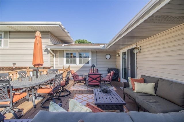 view of patio with a wooden deck, outdoor dining space, and outdoor lounge area