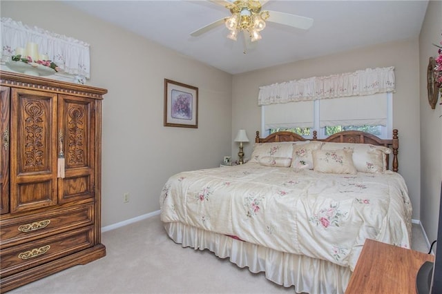 carpeted bedroom featuring baseboards and ceiling fan