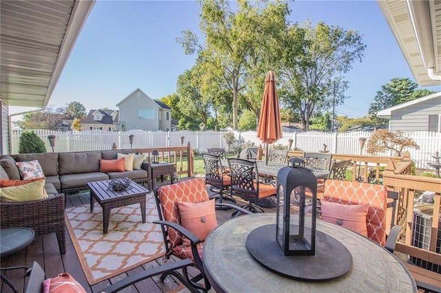 view of patio with outdoor lounge area, outdoor dining area, and a fenced backyard