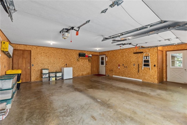 14915 N 8th Ave, Effingham, IL 62401 - garage with a garage door opener and fridge