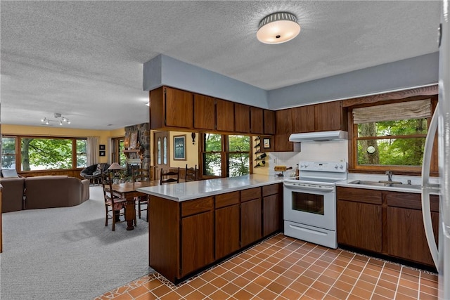 14915 N 8th Ave, Effingham, IL 62401 - kitchen with white electric range oven, exhaust hood, a peninsula, open floor plan, and a textured ceiling