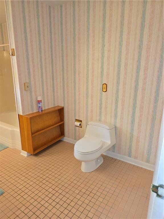 9 Orchard Dr, Charleston, IL 61920 - full bathroom with toilet, wallpapered walls, tile patterned floors, and baseboards