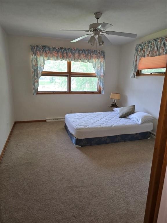 9 Orchard Dr, Charleston, IL 61920 - carpeted bedroom featuring baseboards and ceiling fan