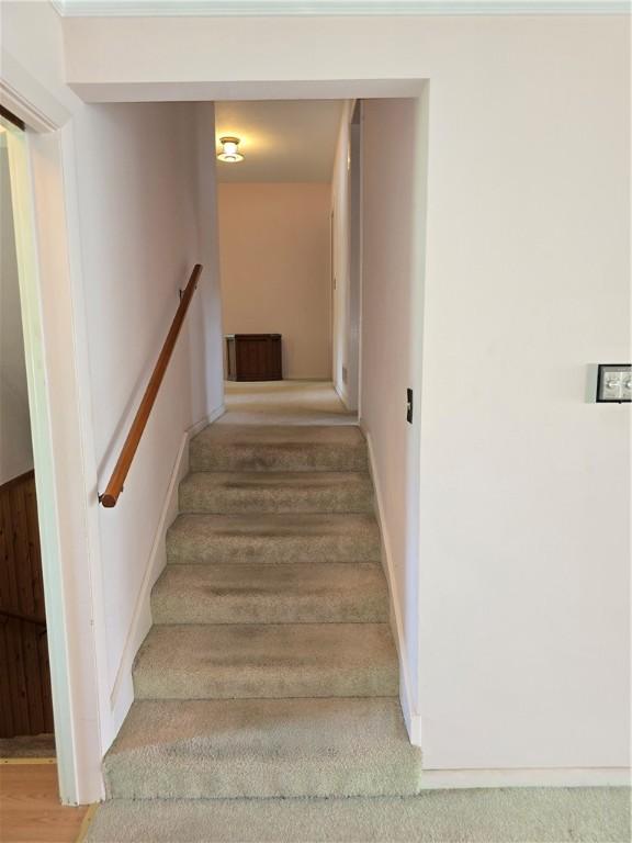 9 Orchard Dr, Charleston, IL 61920 - stairs featuring baseboards