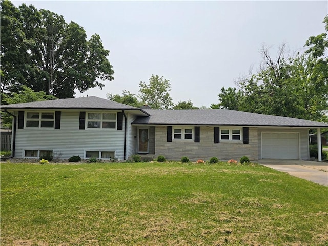 9 Orchard Dr, Charleston, IL 61920 - split level home with a garage, a front lawn, driveway, and stone siding