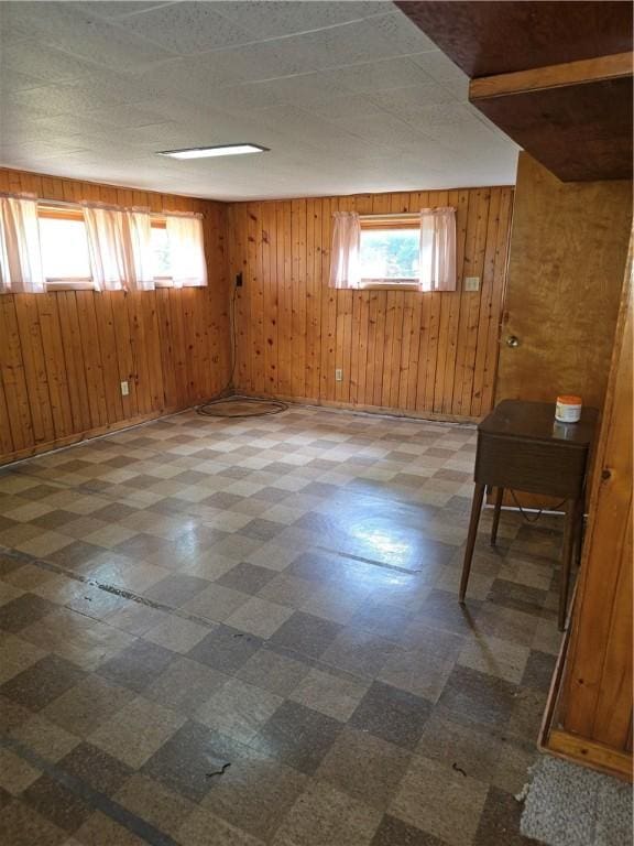 9 Orchard Dr, Charleston, IL 61920 - unfurnished room featuring tile patterned floors and wooden walls