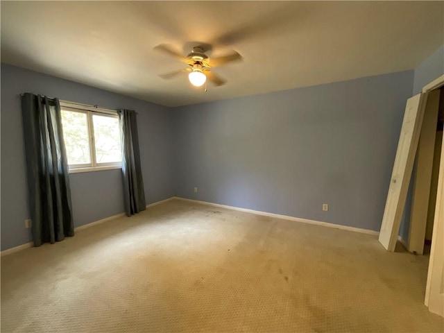1408 Hickory Hill Dr, Effingham, IL 62401 - empty room with a ceiling fan, light colored carpet, and baseboards