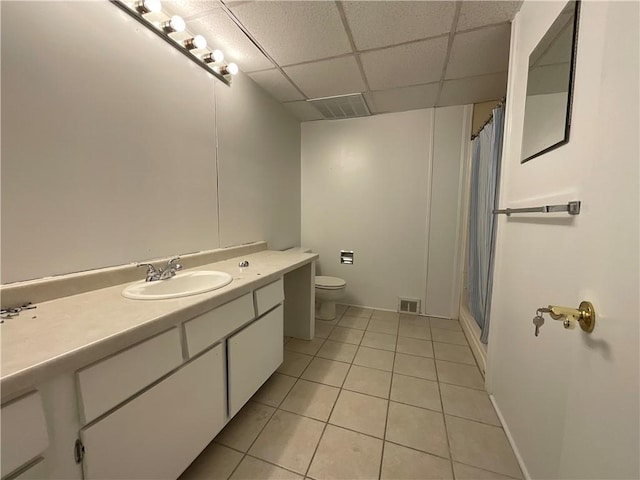 1408 Hickory Hill Dr, Effingham, IL 62401 - bathroom with a paneled ceiling, tile patterned flooring, vanity, toilet, and a shower with curtain