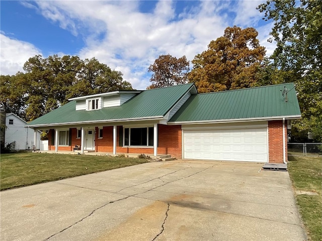 view of front facade with a porch, a garage, and a front lawn