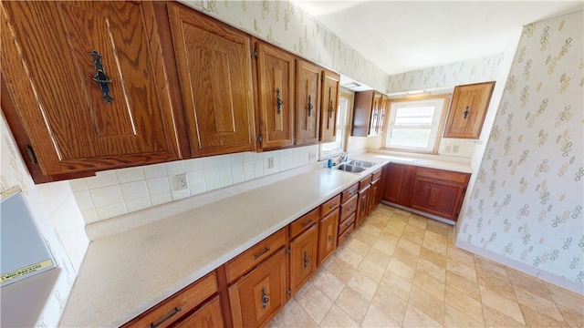 kitchen with decorative backsplash and sink