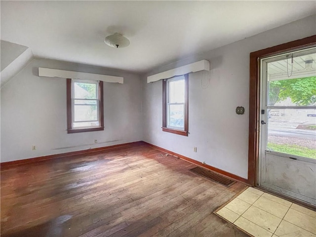 1710 11th St, Charleston, IL 61920 - spare room featuring hardwood / wood-style flooring and baseboards