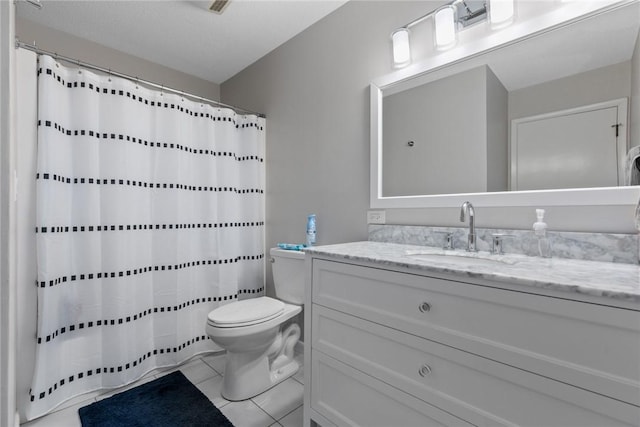 full bath with vanity, toilet, and tile patterned floors