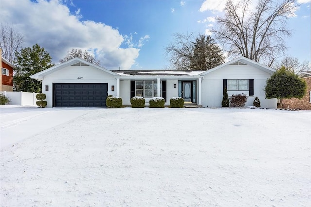 ranch-style home featuring an attached garage