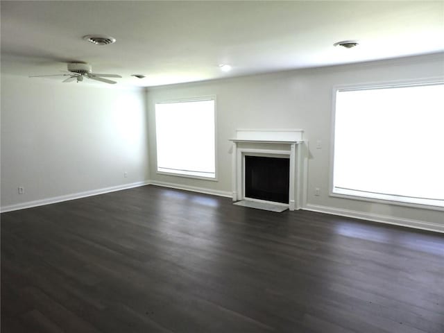 37626 Hunnington Ridge Rd, Hoopeston, IL 60942 - unfurnished living room with a fireplace with flush hearth, dark wood-style floors, and ceiling fan