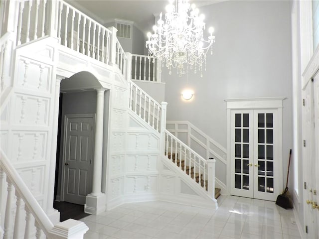 37626 Hunnington Ridge Rd, Hoopeston, IL 60942 - stairs with french doors, a towering ceiling, and tile patterned flooring