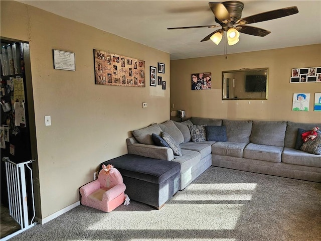 living room featuring ceiling fan and carpet