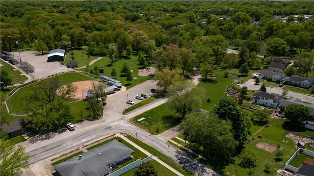 aerial view of property's location featuring a forest