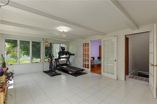 workout room featuring french doors and a textured ceiling