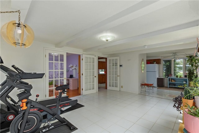 workout room featuring french doors and tile patterned floors