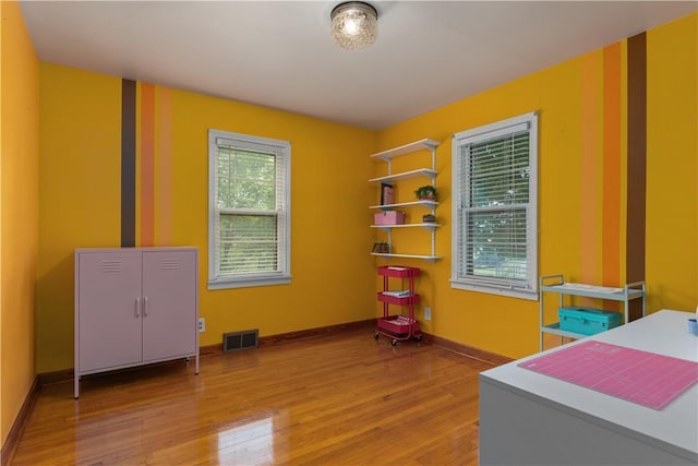 office featuring wood finished floors and baseboards