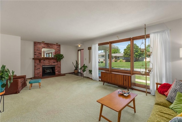 living room with carpet and a fireplace