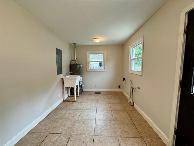 2421 Charleston Ave, Mattoon, IL 61938 - laundry area featuring electric panel, hookup for a washing machine, and light tile patterned flooring