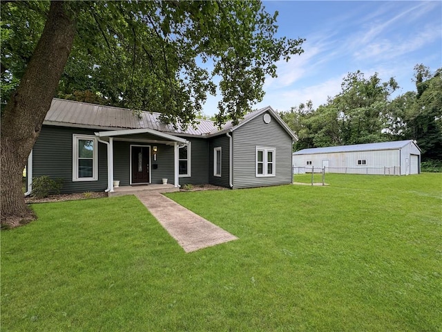 2421 Charleston Ave, Mattoon, IL 61938 - back of property featuring a yard, a metal roof, and covered porch