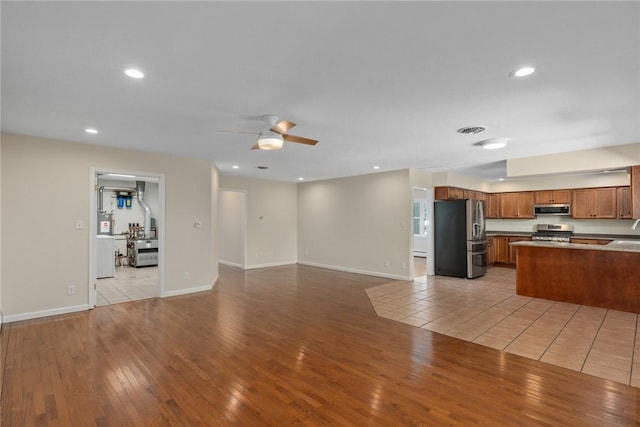 33 Homestead Dr, Newton, IL 62448 - unfurnished living room with ceiling fan, light wood-style floors, baseboards, and recessed lighting