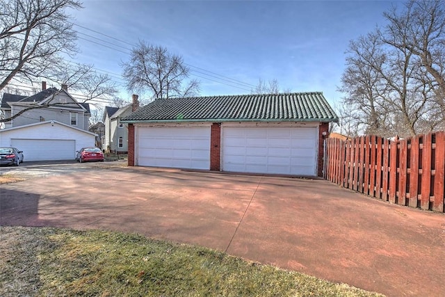 detached garage with fence