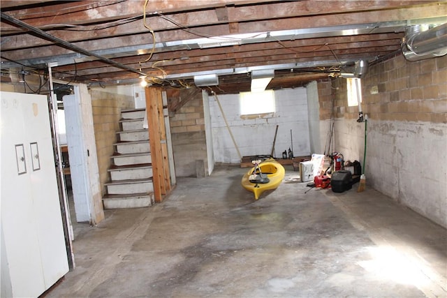 707 W N 2nd St, Shelbyville, IL 62565 - basement with stairs and freestanding refrigerator
