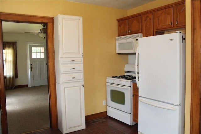 707 W N 2nd St, Shelbyville, IL 62565 - kitchen featuring white appliances, ceiling fan, baseboards, brick patterned flooring, and brown cabinetry