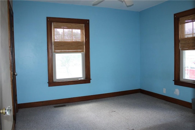 707 W N 2nd St, Shelbyville, IL 62565 - carpeted empty room with baseboards and a ceiling fan