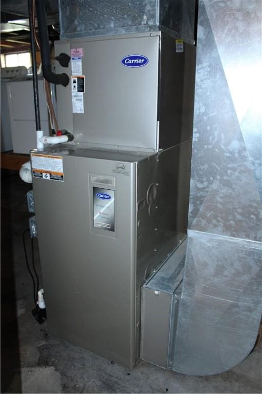 707 W N 2nd St, Shelbyville, IL 62565 - utility room featuring heating unit