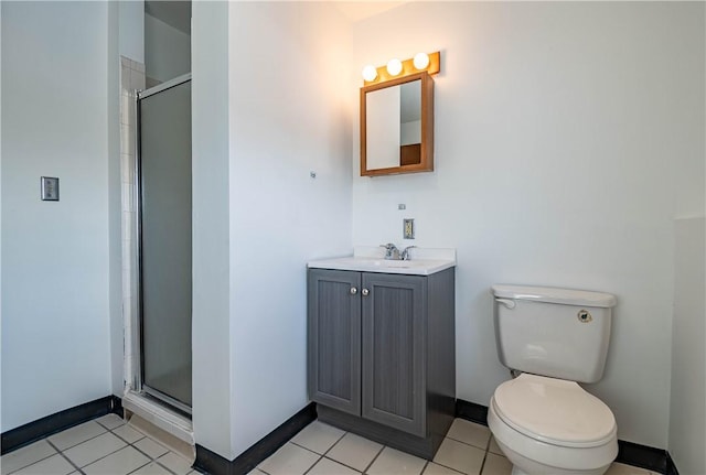 bathroom with tile patterned flooring, toilet, vanity, and a shower with shower door