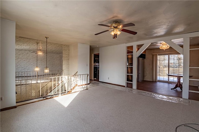 carpeted empty room featuring ceiling fan