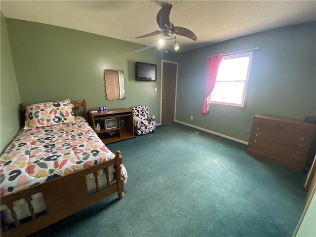 bedroom with carpet floors, ceiling fan, a textured ceiling, and baseboards