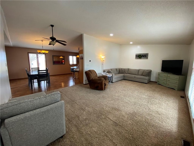 living area featuring a ceiling fan, recessed lighting, visible vents, and carpet flooring