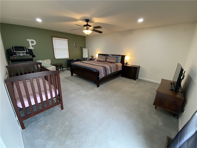 bedroom with a ceiling fan, recessed lighting, light colored carpet, and baseboards