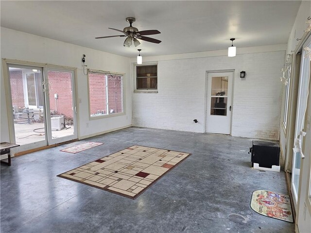 exterior space featuring ceiling fan