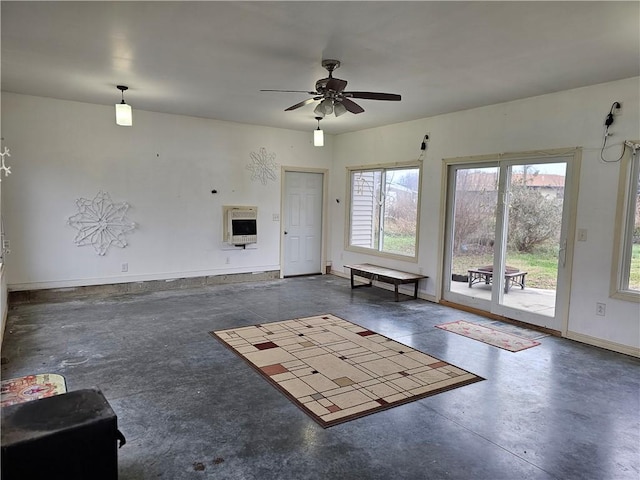 interior space with heating unit and ceiling fan